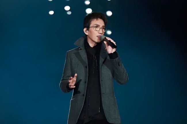 何炅说到林志炫淘汰时抽泣红了眼眶 争议与真相背后的音乐战争